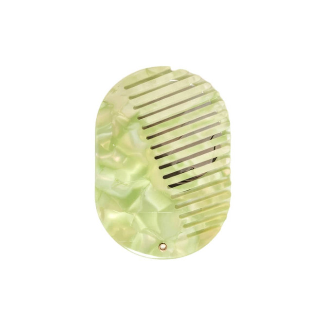 A portable green acetate hair comb with a mirror, featuring a textured design and a compact shape.