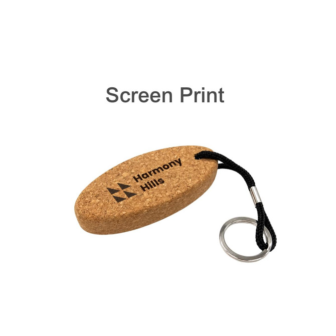 An oval cork keyring with a black strap and metal keyring attachment, featuring a logo on one side.