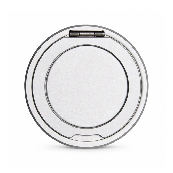 A round, silver magnetic charger with a stand, featuring a smooth surface and a hinged element.