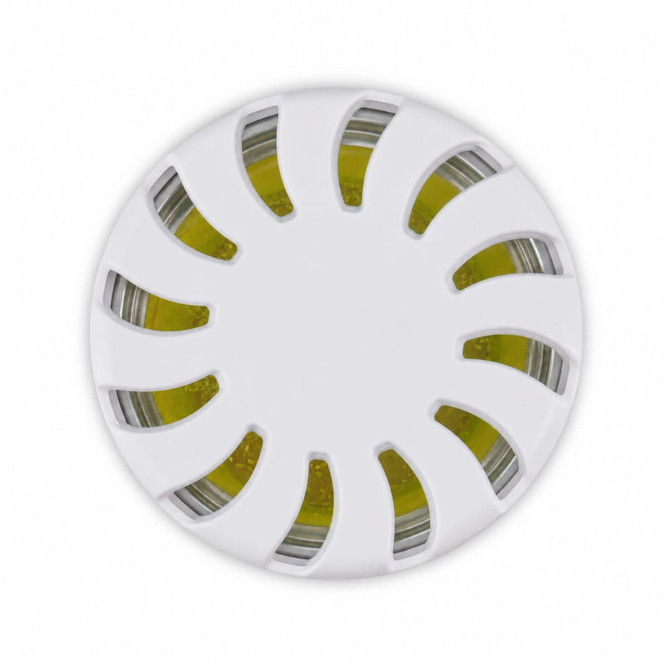 A round white fragrance pot with a decorative lid, featuring a yellow fragrance inside.