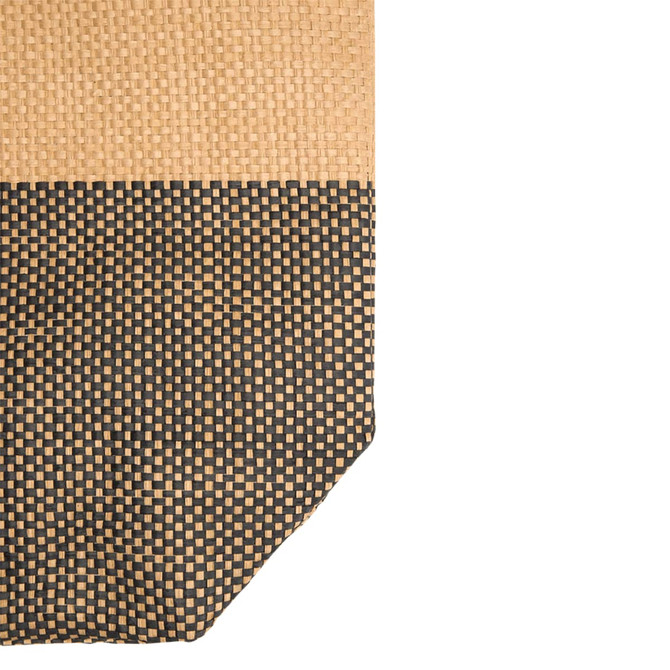 A large tote bag featuring a woven design in beige and black, with a textured surface and a logo.