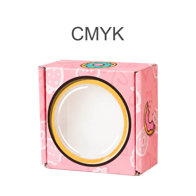 A small pink gift box with a round window and playful illustrations, featuring a logo on the front.