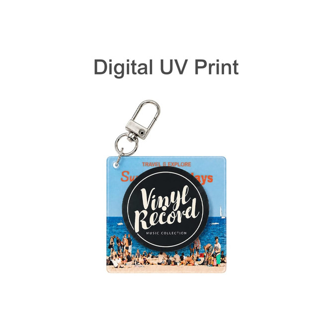 A clear acrylic keychain featuring a vinyl record design with a beach scene background and a metal clasp.