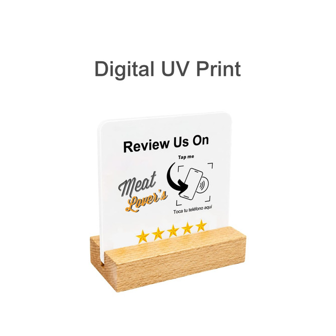A clear acrylic menu with digital UV print, featuring a wooden stand and a logo, set against a simple background.