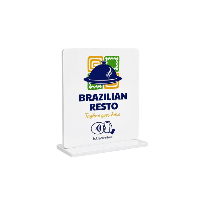 A white acrylic menu stand featuring a logo and a graphic for NFC interaction, with colourful background patterns.