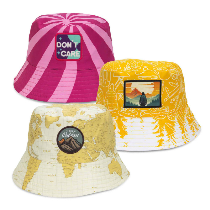 A custom bucket hat featuring a pink design with stripes, a yellow design with a landscape patch, and a map-patterned design.