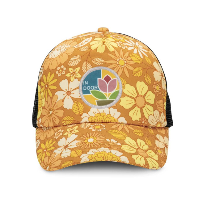 A trucker cap in orange with floral patterns and a circular logo patch on the front.