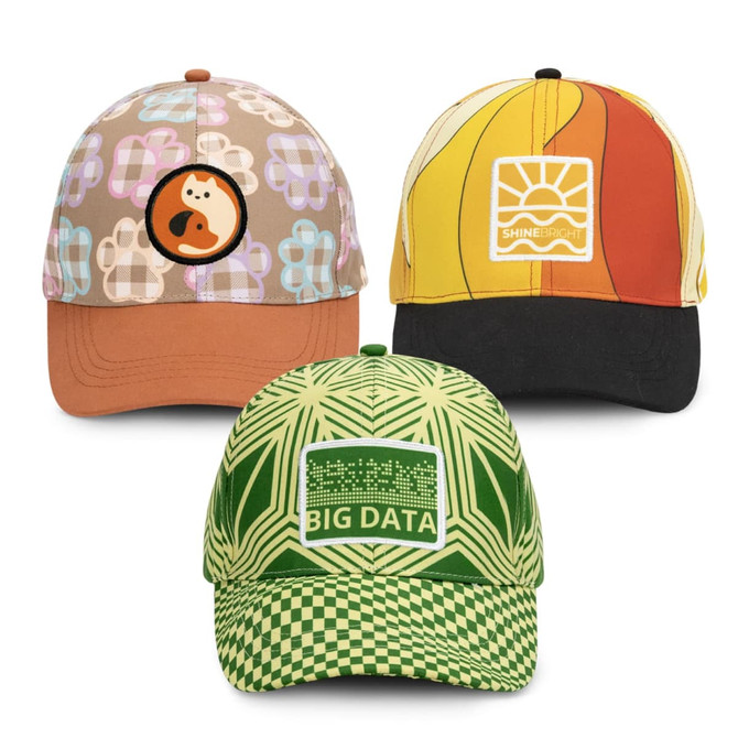 Three caps featuring unique full-colour patches: a brown floral design, a sunset pattern in orange and yellow, and a green checkered style.