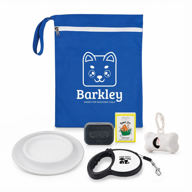 A blue pouch contains a dog leash, bowl, soap, toy, and bone-shaped item, along with a logo.