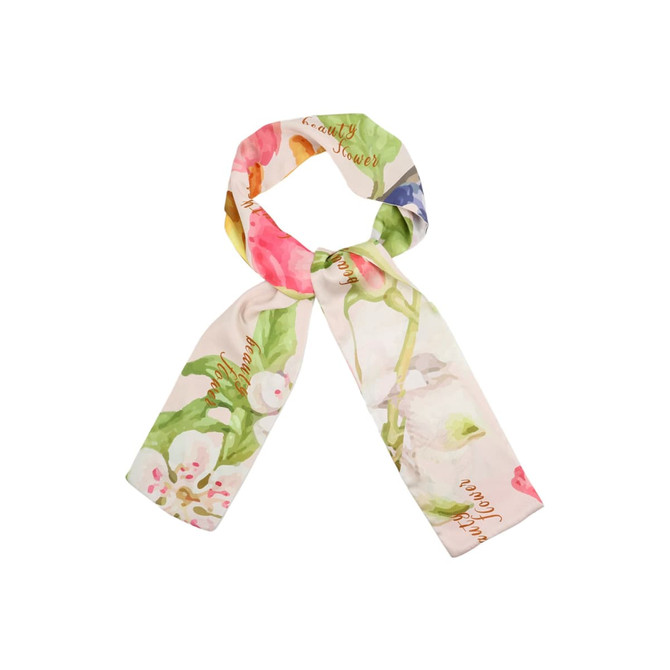 A long scarf in a twill weave featuring a floral design in shades of pink, green, and yellow, with a branding logo.