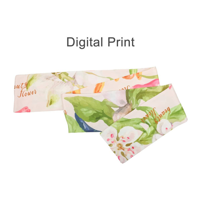 A twill weave long scarf featuring a digital print with floral designs in soft pastel colours. It has a logo.