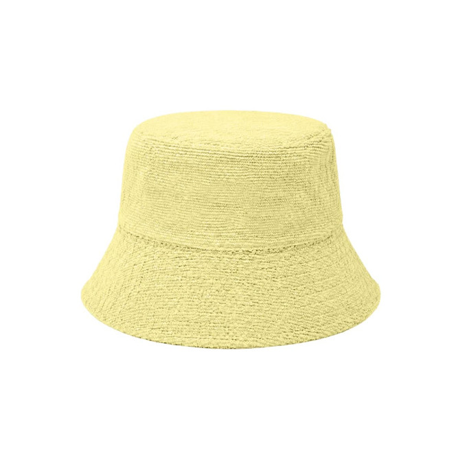 A yellow dual-material reversible bucket hat with a textured fabric design. It features a simple shape and wide brim.