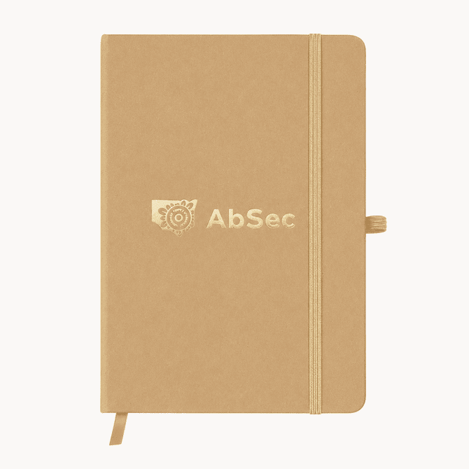 A beige A5 notebook with an elastic closure and a branding logo on the cover.