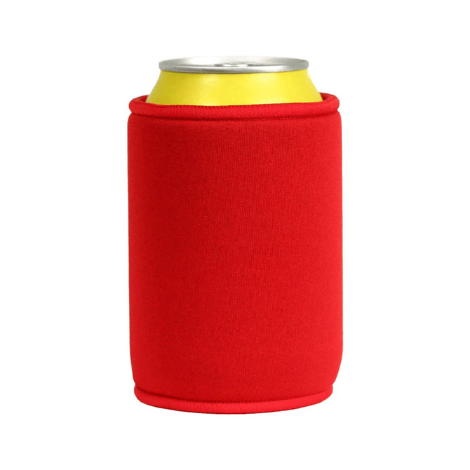 A red stubby holder fits around a drink can, featuring a smooth fabric surface and a logo.
