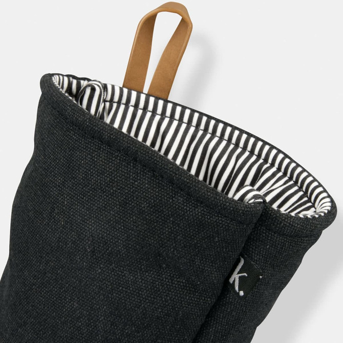 A black oven mitt with a striped interior and a hanging loop, featuring a small logo.