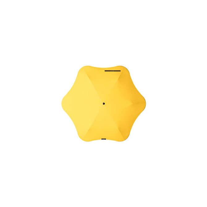 A yellow BLUNT Neo Umbrella with a unique star-shaped design and a central black button.