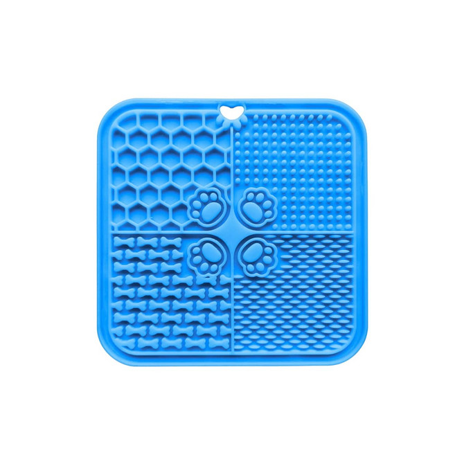 A blue, silicone dog enrichment lick mat divided into four sections with various textured patterns and a paw print design.