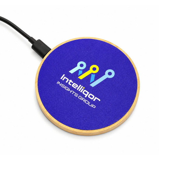 A circular wireless charger with a wooden base and a blue top featuring a logo.