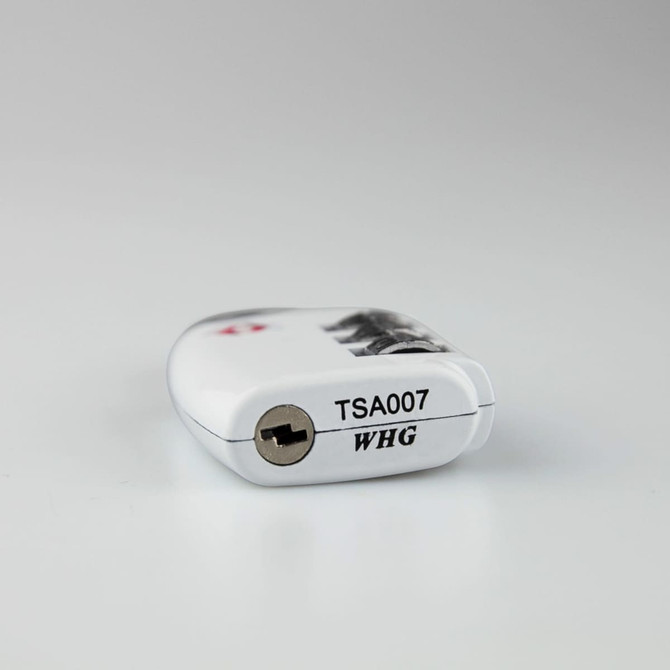 A portable luggage TSA lock in white with a keyhole, featuring a black and silver design and a logo.