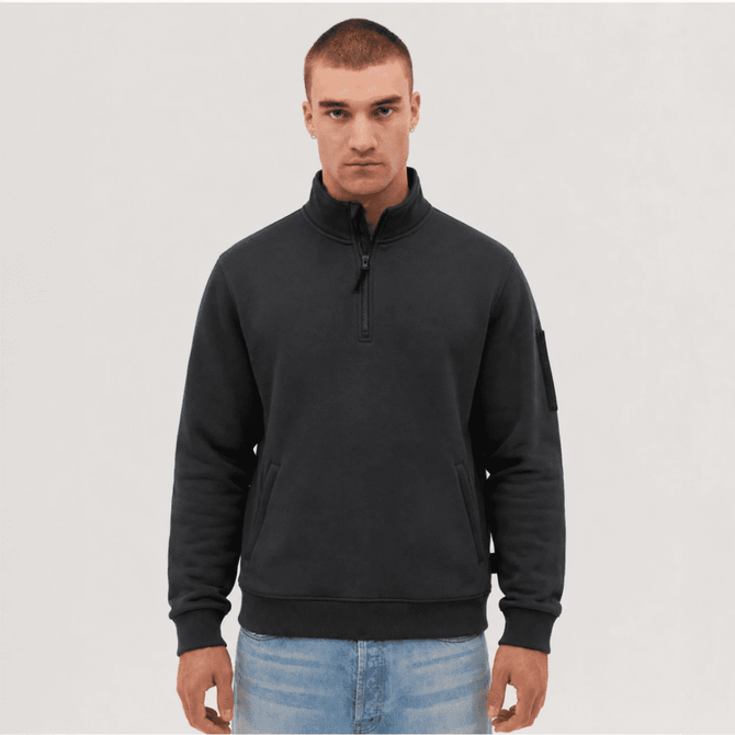 A fleece 1/4 zip pullover in black, featuring a high collar and a left sleeve logo.