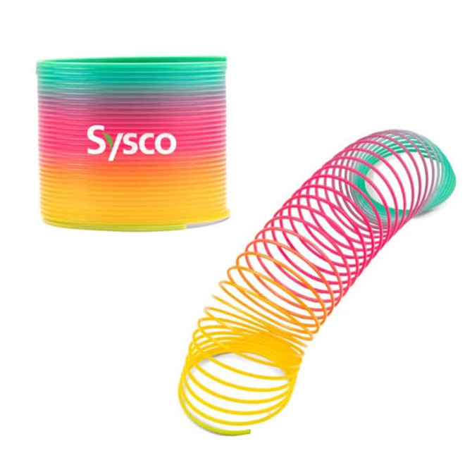 A rainbow-coloured slinky spiral toy with a vibrant gradient from pink to yellow and green. It comes with a branded container.