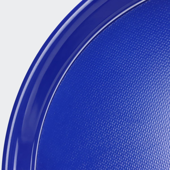 A blue serving tray with a textured surface and a smooth rim, featuring a circular shape and a glossy finish.