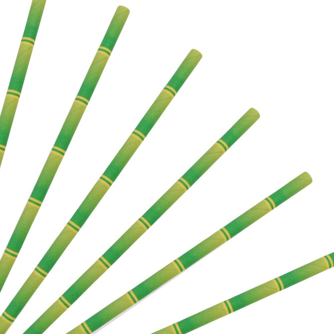 A collection of green and yellow disposable 3-ply straight drinking paper straws arranged in a fan shape.