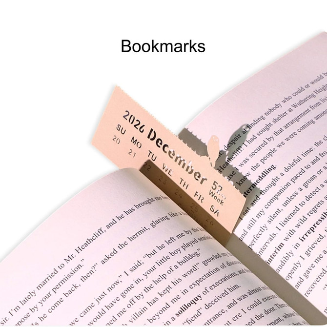 A pink bookmark positioned in a book, with a calendar date visible and a subtle logo in the corner.