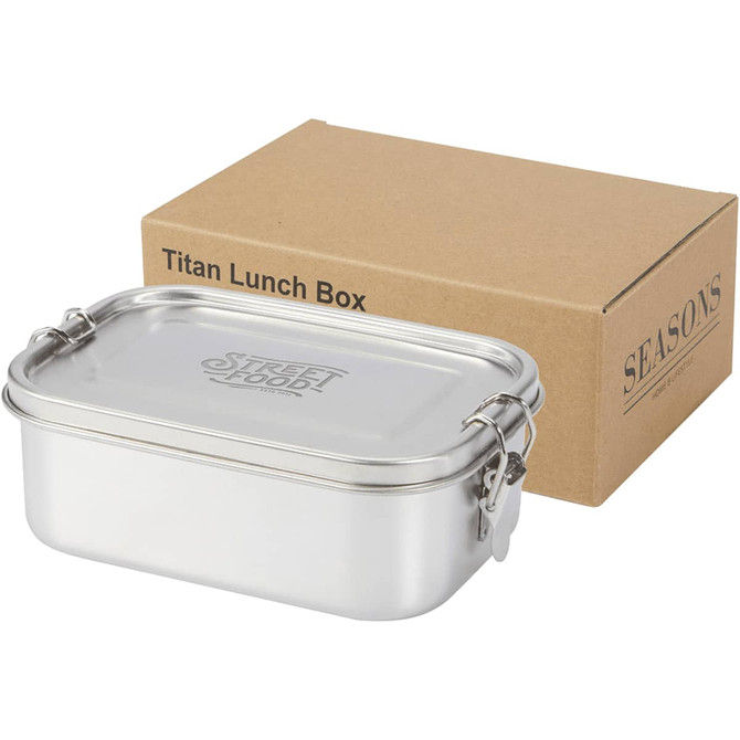 A stainless steel lunch box in silver, accompanied by a cardboard box with a logo.