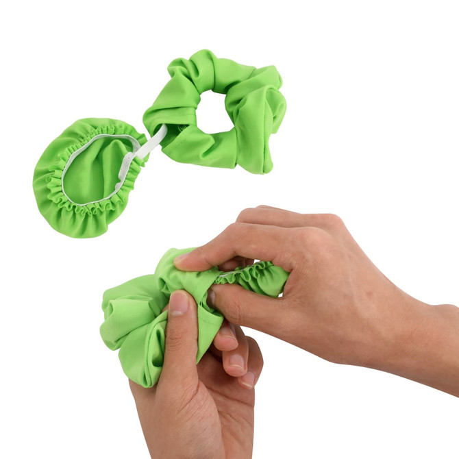 A green scrunchie-style drink cover and a hand holding the scrunchie, demonstrating its elastic feature.