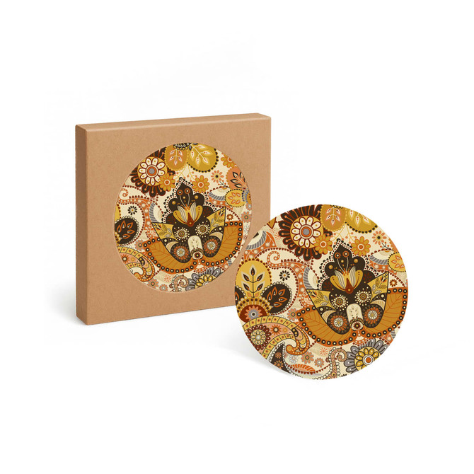 A round ceramic coaster with a floral design in warm colours, presented in a plain brown box.