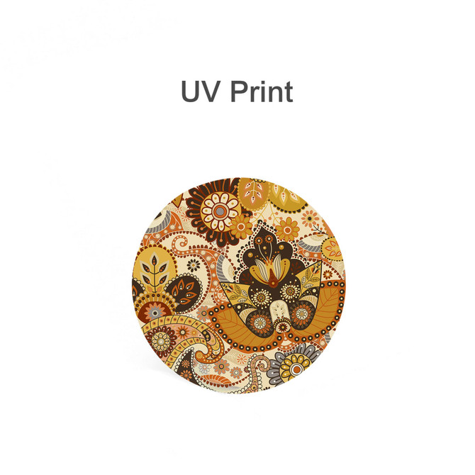 A round ceramic coaster featuring a vibrant design in orange, yellow, and brown tones, with intricate floral patterns.