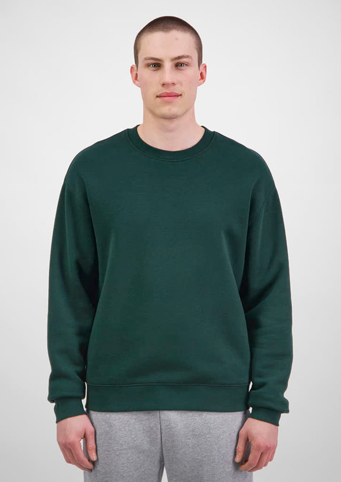 A green men's everyday crew sweatshirt displayed on a model, featured with a plain design and a logo.