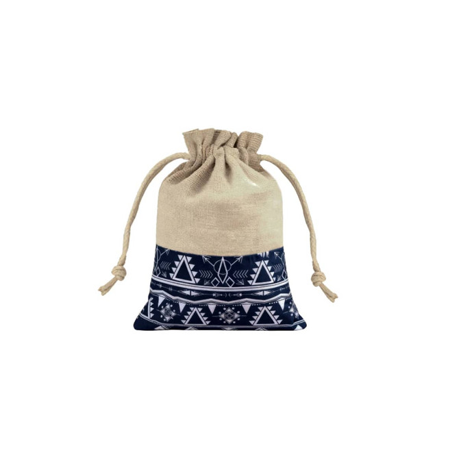 A cotton linen drawstring bag featuring a navy and white patchwork design with tribal patterns and a jute top.