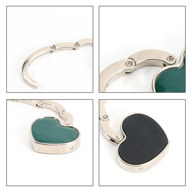 A heart-shaped foldable desk hook featuring a silver metal frame with green and black sections.