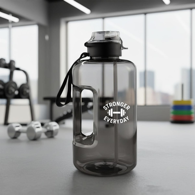 A drink bottle in grey with a handle and a black lid, featuring a logo on one side.