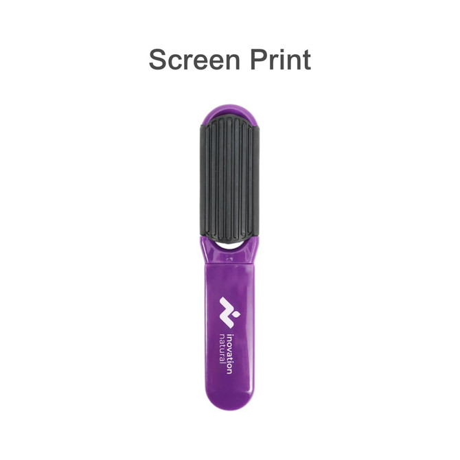 A folding hair brush with a mirror, featuring a purple handle and a black textured grip. It has a branding logo.