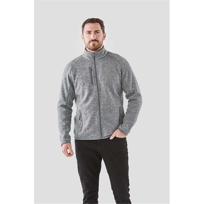 A men's grey fleece jacket with a full zip and a zippered chest pocket. It features a subtle logo.