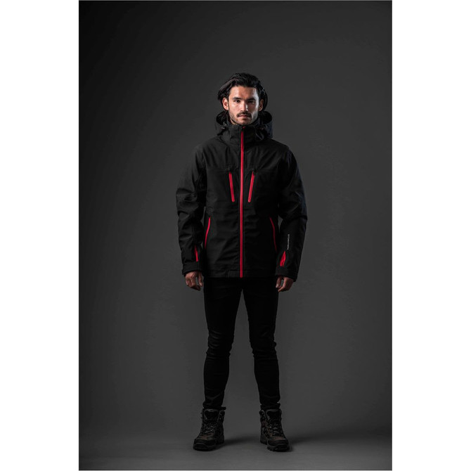 A men's jacket in black with red accents, featuring a hood and multiple zippered pockets, displayed on a model.