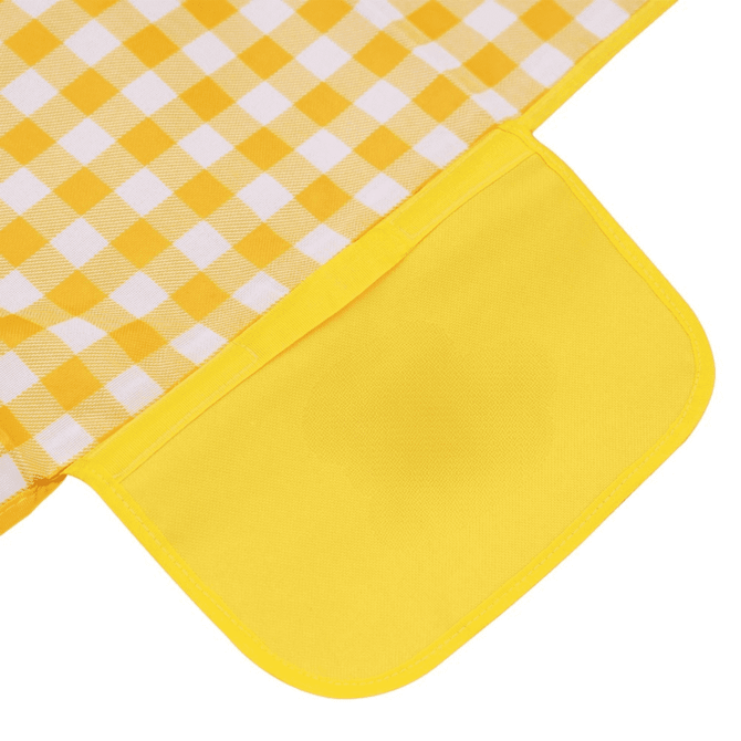 A yellow and white checked picnic blanket featuring a solid yellow pocket. It has a branded logo on the corner.