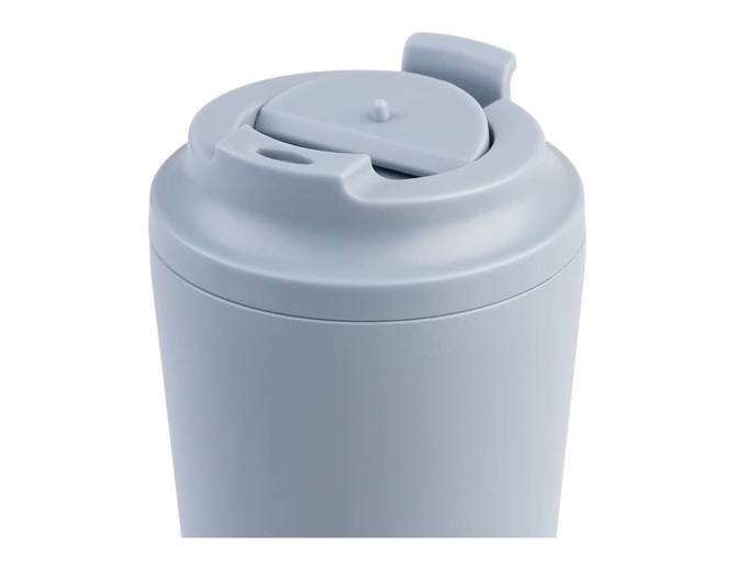 A drink bottle in pale blue with a lid featuring a push-button opening and a small spout, branded logo visible.