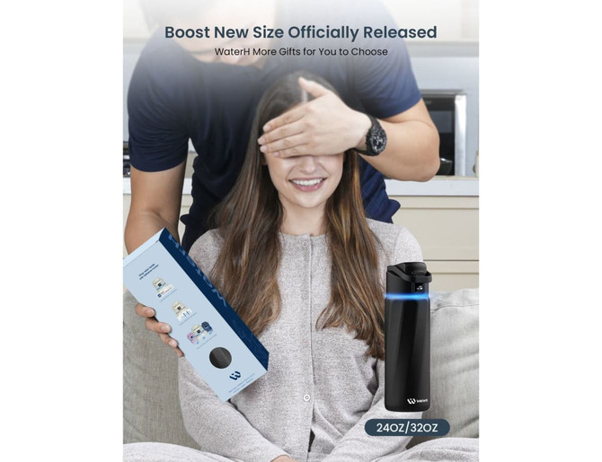A drink bottle in black with a sleek design, displayed alongside its packaging and a person holding it.