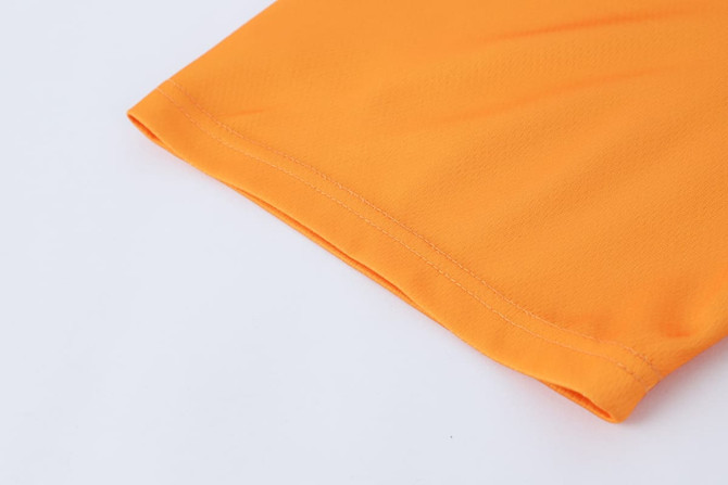 An orange 100% polyester micro mesh long-sleeved shirt with a smooth finish, featuring a logo.
