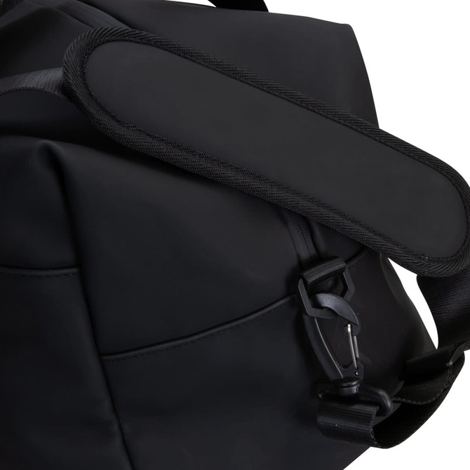 A black soft-touch duffle bag featuring a padded shoulder strap and a clip closure.