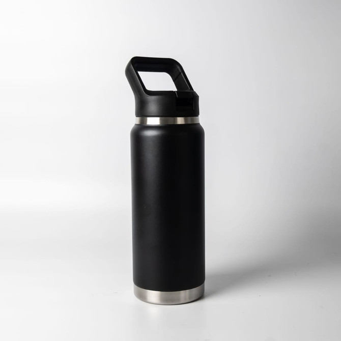 A drink bottle in black stainless steel with a silver base and a handle for easy carrying.