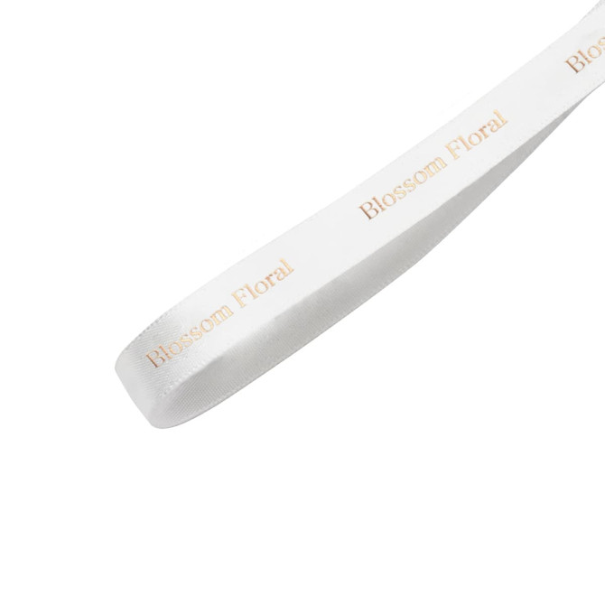 A satin polyester ribbon in white with a gold branding logo printed along its length.