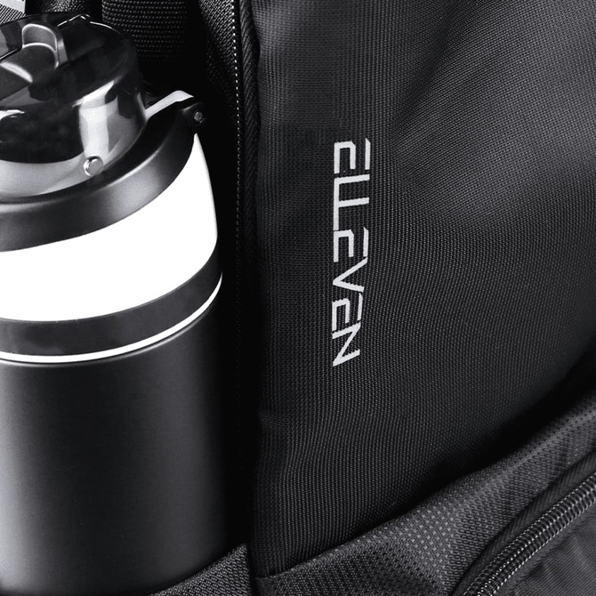 A black backpack featuring a drink bottle with a black and white design and a branded logo.