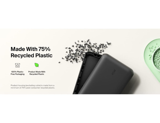 A black power bank with an integrated cable, featuring a logo and made from recycled plastic.