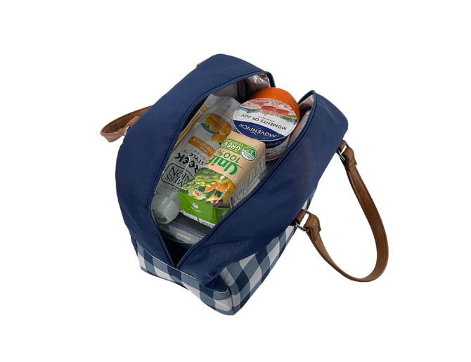 A blue and white checkered insulated lunch bag with a brown strap, filled with drinks and snacks.