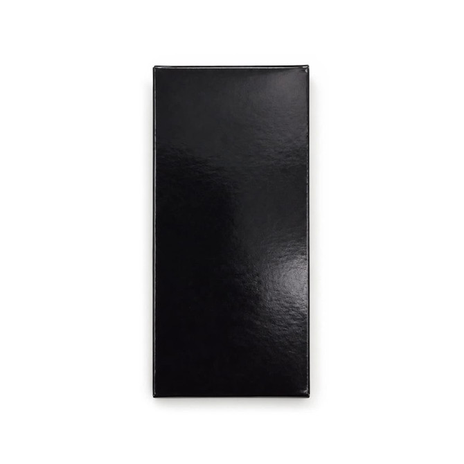 A sleek black rectangular packaging, featuring a glossy finish and a logo on the front.